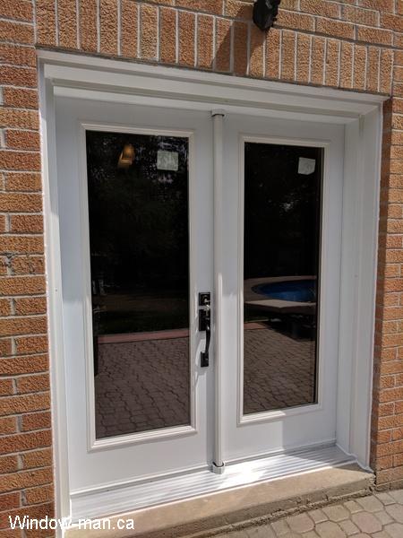 French patio Doors. Full glass. White. Low e coating, Argon gas. Professional installed